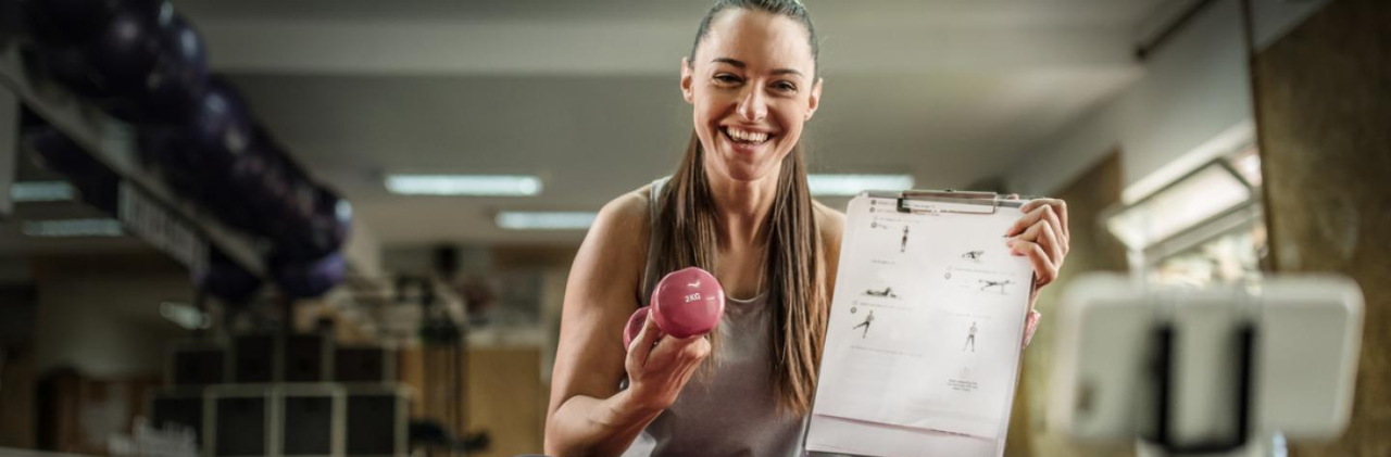 woman holding light dumbbell